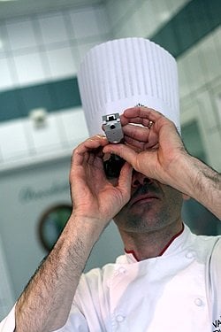 chef givre checking his refractometer