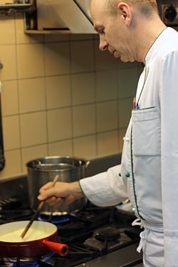 chef making fondue