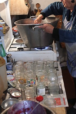 stirring red currant jam