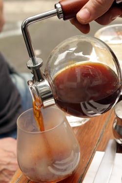 pouring siphon coffee