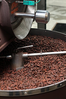 grinding cocoa beans for paris chocolate