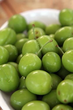 tiny green plums