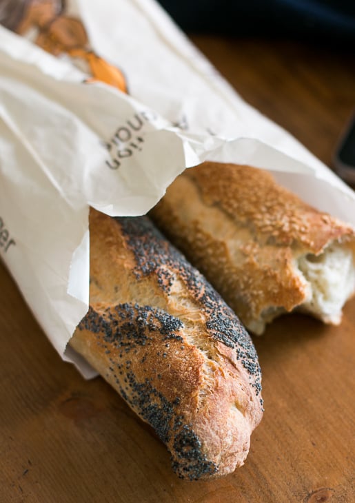 Baguette, European style bread on black wood table in morning time