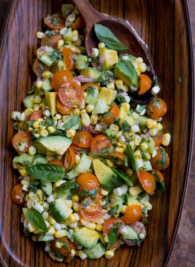 Fresh corn, tomato, avocado and basil salad