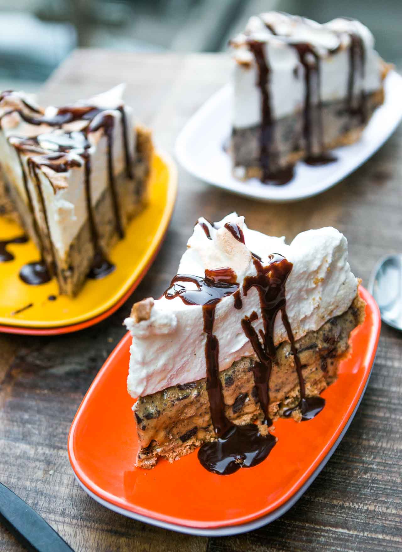 Ice cream pie topped with marshmallows and salted dark chocolate sauce